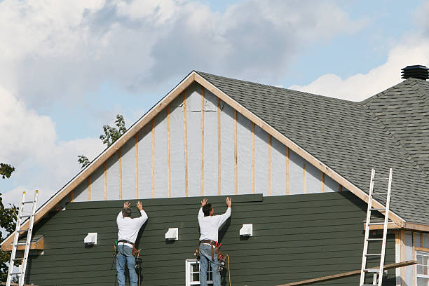 Professional Siding Contractor technician working in Springs, NY